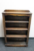 A set of Edwardian oak open shelves