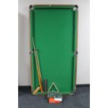 A 6' folding snooker table with accessories