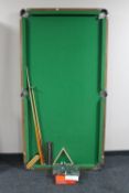 A 6' folding snooker table with accessories
