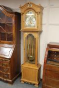 A continental oak longcase clock with brass dial signed Carl Nielsen, Roskilde,