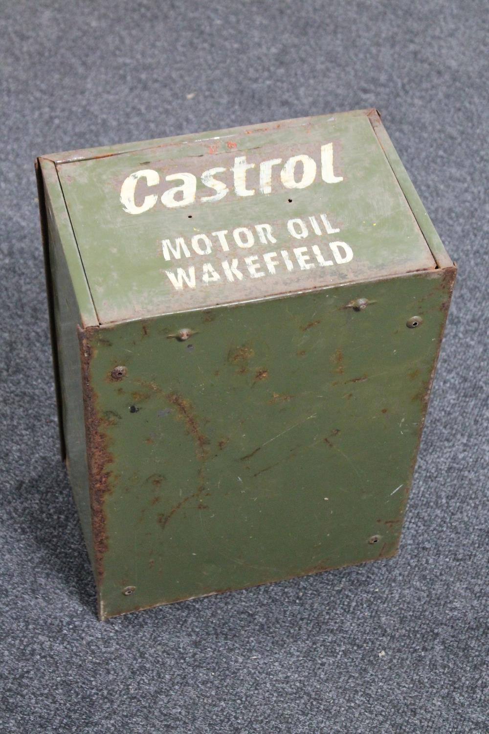 A metal drawer bearing Castrol advertising