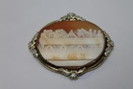 A large oval gold and enamel cameo brooch depicting The Last Supper