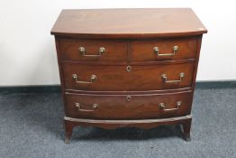 A 20th century continental mahogany bowfront three drawer chest