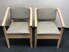 A pair of contemporary beech framed commode armchairs