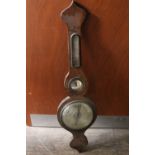 A mahogany banjo barometer with silvered dial