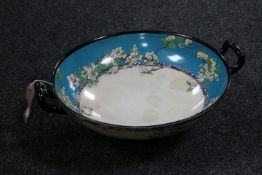 A Royal Doulton twin handled comport with flower decoration