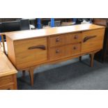 A 20th century teak low sideboard