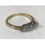 An 18ct gold three stone diamond ring, the total diamond weight estimated at 0.