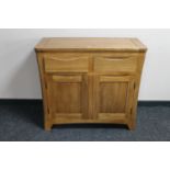 A contemporary oak double door sideboard