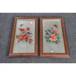 A pair of antique hand painted hall mirrors depicting flowers and butterflies