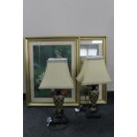 A pair of gilt framed lithographic prints and a pair of table lamps