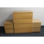 An Ikea oak effect four drawer chest and pair of two drawer chests