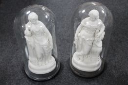 Two Parian female figures under Victorian glass domes