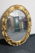 An ornate gilt framed mirror