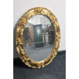 An ornate gilt framed mirror