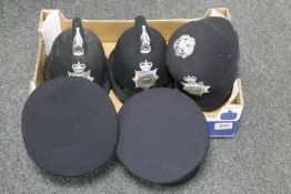 A box of five police helmets