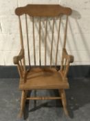 A pine spindle back rocking chair