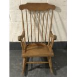 A pine spindle back rocking chair