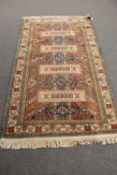 An antique Caucasian rug,