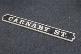 A cast iron Carnaby St sign