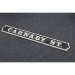 A cast iron Carnaby St sign