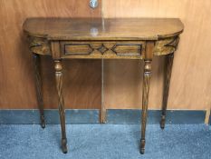 A shaped hall table on reeded legs fitted a drawer CONDITION REPORT: 99cm wide by