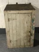 An antique pitch pine singled door cupboard,