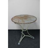 A circular metal patio table