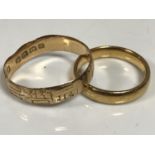 An 18ct gold band ring (misshapen),