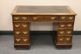 A Victorian twin pedestal writing desk fitted nine drawers with brass drop handles
