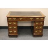 A Victorian twin pedestal writing desk fitted nine drawers with brass drop handles