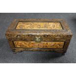 A small carved camphor wood chest