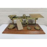 A set of Victorian brass postal scales with weights