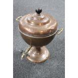 An antique copper and brass samovar