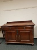 A late Victorian mahogany two drawer sideboard,