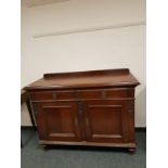 A late Victorian mahogany two drawer sideboard,