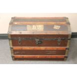 An early 20th century domed topped shipping trunk