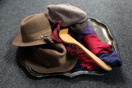 A vintage metal tray of assorted vintage scarves and hats