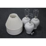 A set of three pottery table lamps and shades