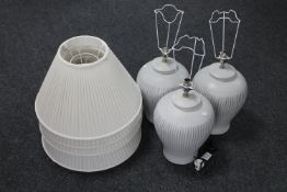 A set of three pottery table lamps and shades