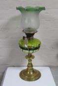 A brass oil lamp with etched shade and painted reservoir CONDITION REPORT: Several