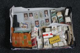 A box of assorted cigarette and cigar cards,