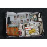 A box of assorted cigarette and cigar cards,