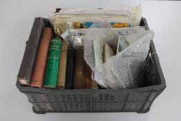 A crate of vintage postcards and photographs,