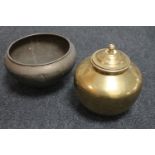 A brass lidded pot and a brass planter