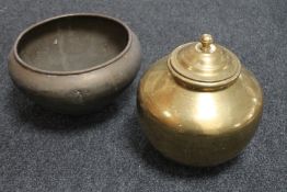 A brass lidded pot and a brass planter