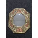A copper and brass octagonal Arts & Crafts framed mirror