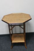 An octagonal occasional table on bamboo base
