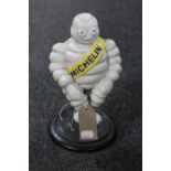 A cast iron figure - seated Michelin man