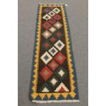 An Eastern flat weave runner,